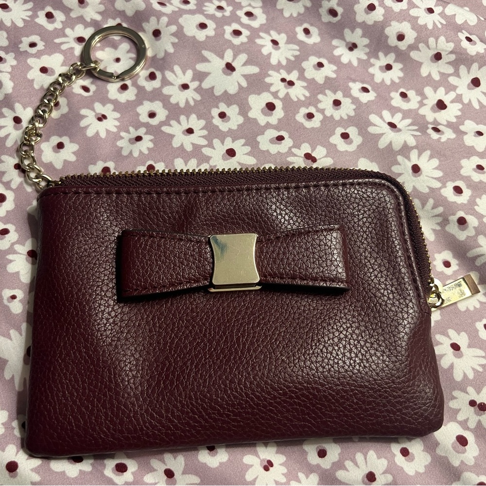 Purple zipper pouch with card slots with a bow